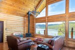 Take in breathtaking views of Whitefish Lake as you relax in the living room.